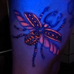 Tattoo escarabajo neon