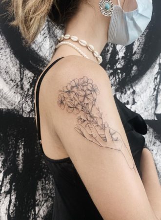 fine line flower tattoo